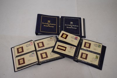 Lot 327 - 22ct Golden Replicas of British stamps in four albums