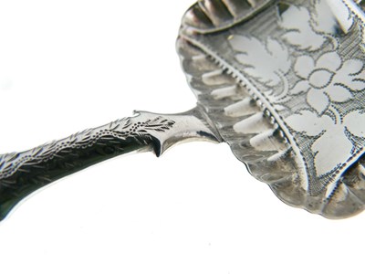 Lot 135 - George IV silver caddy spoon with bright cut decoration