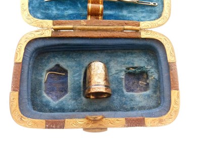 Lot 141 - Late 19th Century brown Morocco and brass cased sewing compendium