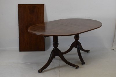 Lot 591 - 'Old reproduction' mahogany twin pillar dining table