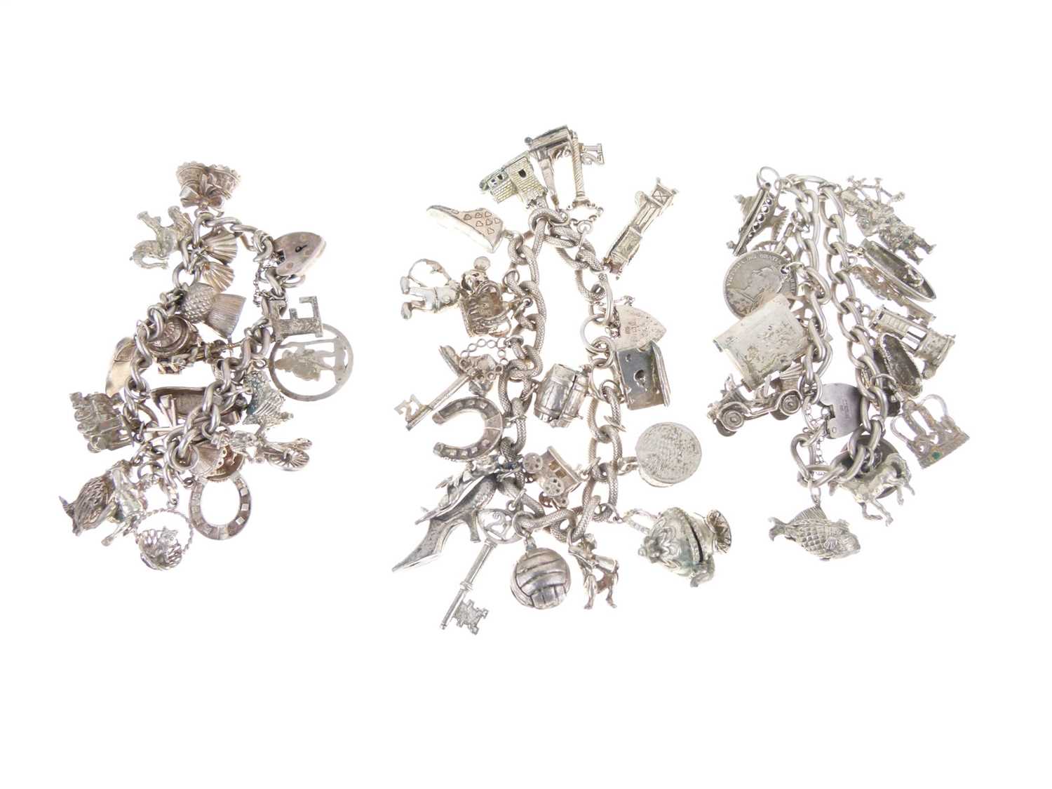 Lot 129 - Three silver charm bracelets