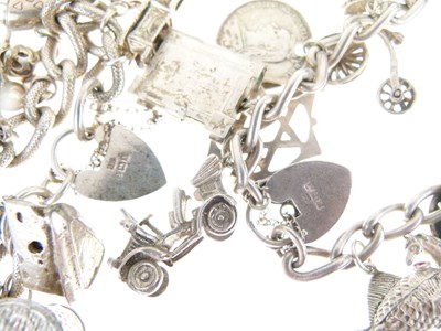 Lot 129 - Three silver charm bracelets