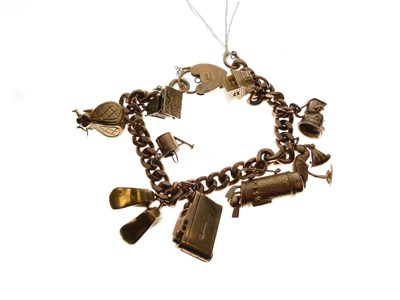 Lot 128 - 9ct gold curb-link bracelet attached nine charms