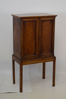 Lot 637 - Edwardian veneered cabinet on later stand