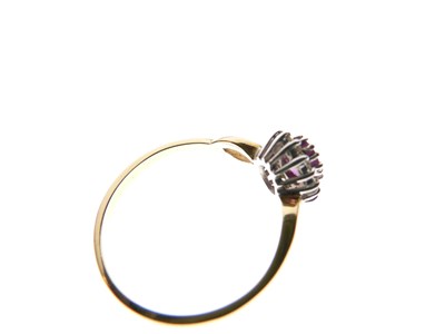 Lot 21 - 18ct gold, ruby and diamond cluster ring