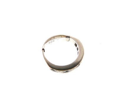 Lot 18 - Yellow metal (18ct), diamond and sapphire half hoop ring