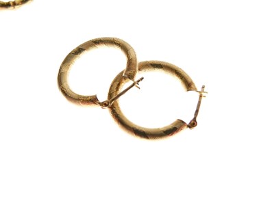 Lot 134 - Three pairs of 9ct gold hoop earrings
