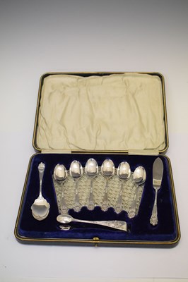 Lot 257 - Six silver teaspoons with floral terminals and matching sugar tongs, preserve spoon & butter knife