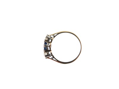 Lot 20 - Sapphire and diamond three-stone ring