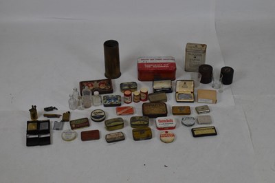 Lot 359 - Shell case vase and group of lighters/tins