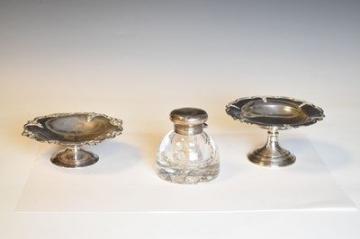 Lot 244 - Two George V silver pedestal dishes and a silver capped glass ink well