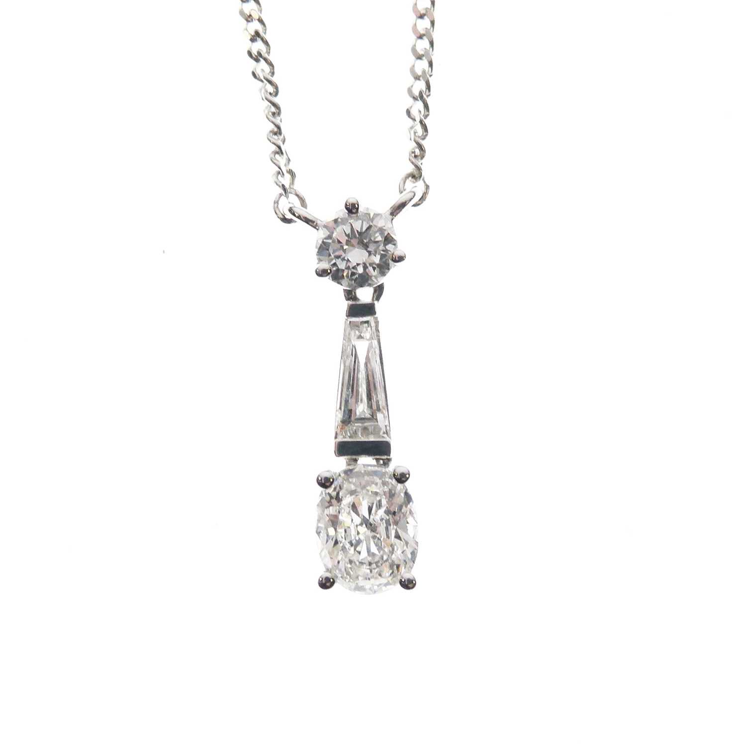 Lot 103 - 18ct white gold three-stone diamond pendant