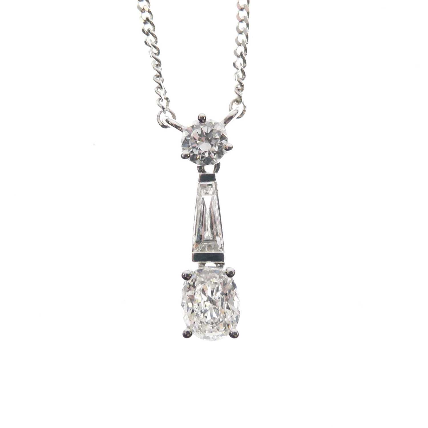 Lot 103 - 18ct white gold three-stone diamond pendant