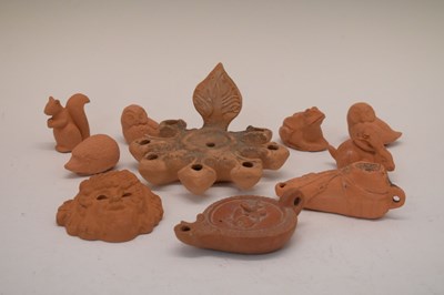 Lot 175 - Group of terracotta lamps