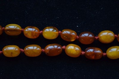 Lot 80 - Graduated row of amber beads