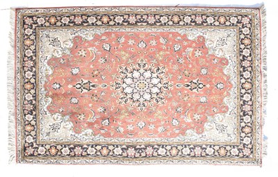 Lot 469 - Persian wool rug, pink ground