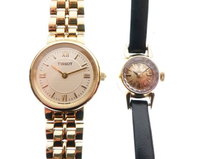 Lot 68 - Omega - Lady's 18K wristwatch together with Tissot gold plated stainless steel watch