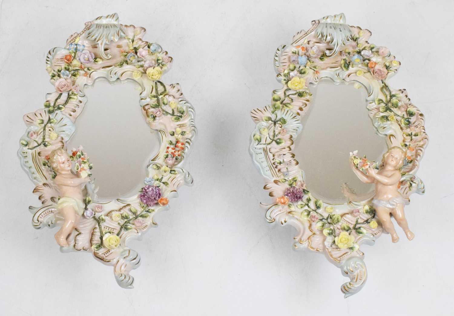 Lot 275 - Pair of 20th Century German Sitzendorf porcelain mirrors