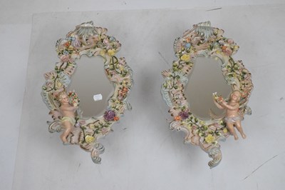 Lot 275 - Pair of 20th Century German Sitzendorf porcelain mirrors