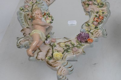 Lot 275 - Pair of 20th Century German Sitzendorf porcelain mirrors