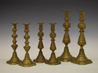 Lot 456 - Three pairs of brass candlesticks