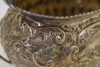Lot 86 - Late Victorian two handled silver sugar bowl with embossed decoration