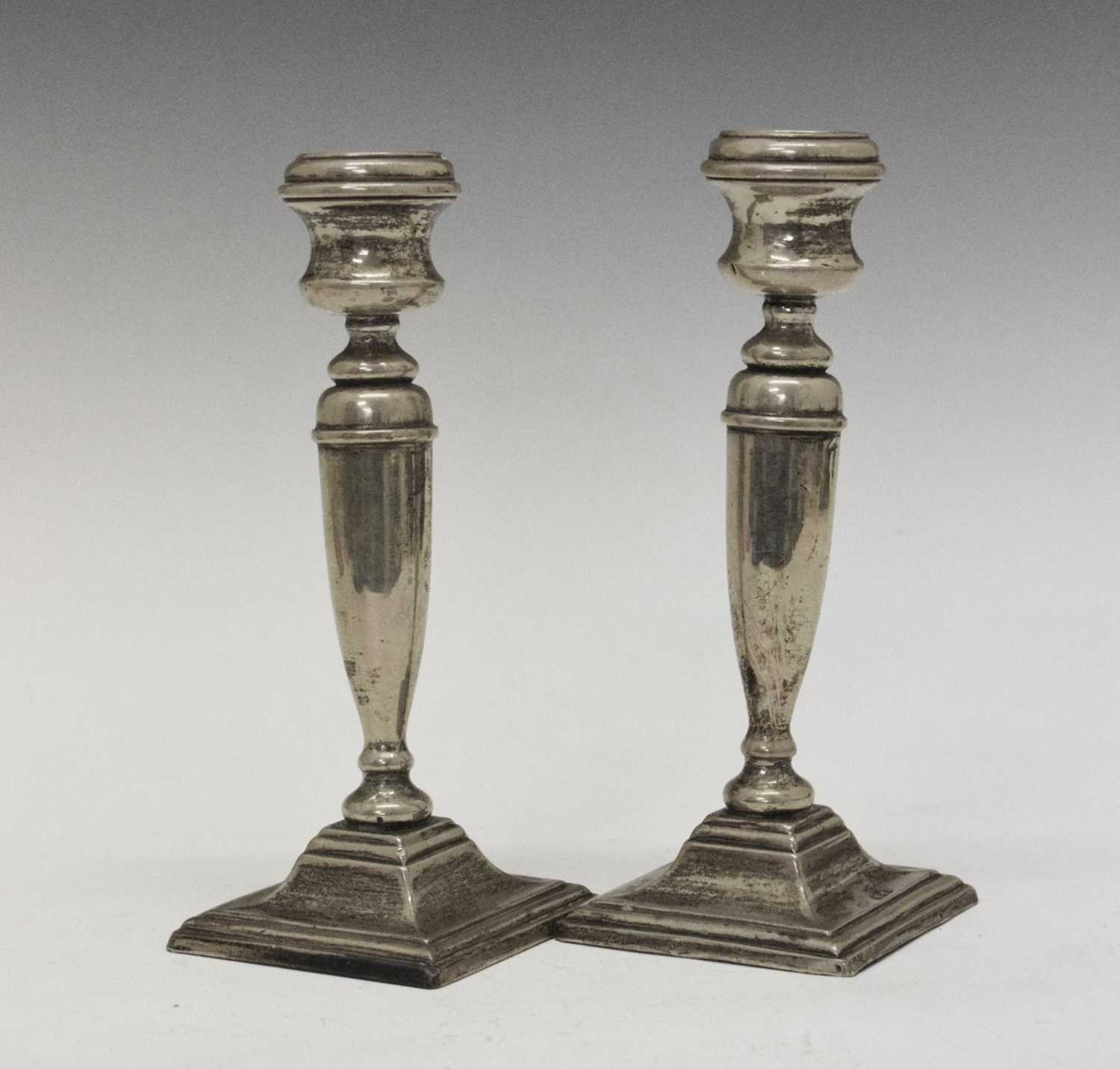 Lot 97 - Pair of George V silver candlesticks
