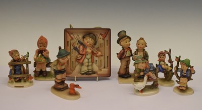 Lot 331 - Seven Goebel Hummel figures and a wall plaque