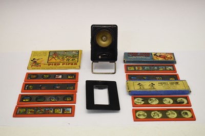 Lot 186 - Three Walt Disney lantern slides together with a Mickey Mouse Toy Lantern