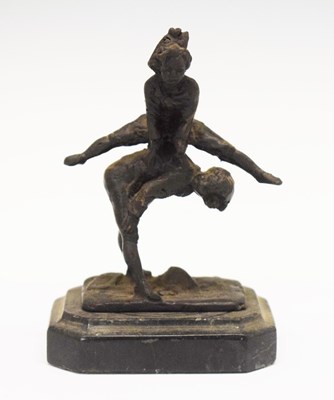 Lot 185 - Cast metal figure of children leap-frogging