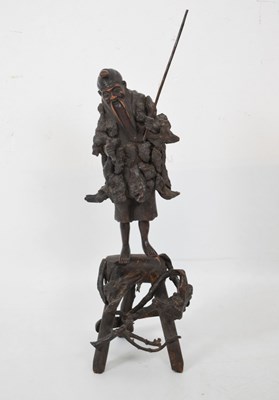 Lot 348 - Oriental wooden carving of a fisherman