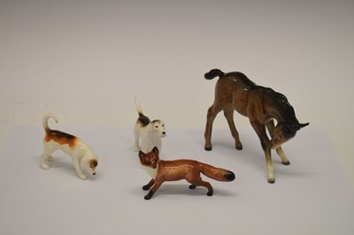 Lot 332 - Beswick pony with two hounds and a fox