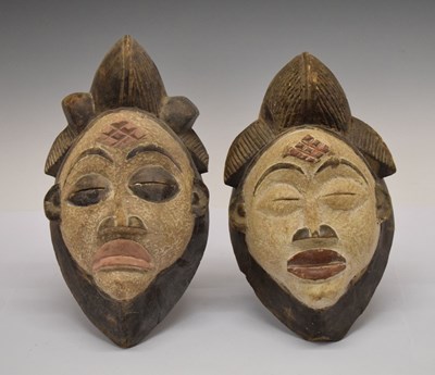 Lot 187 - Ethnographica - two African tribal carved wooden masks, Punu, Gabon