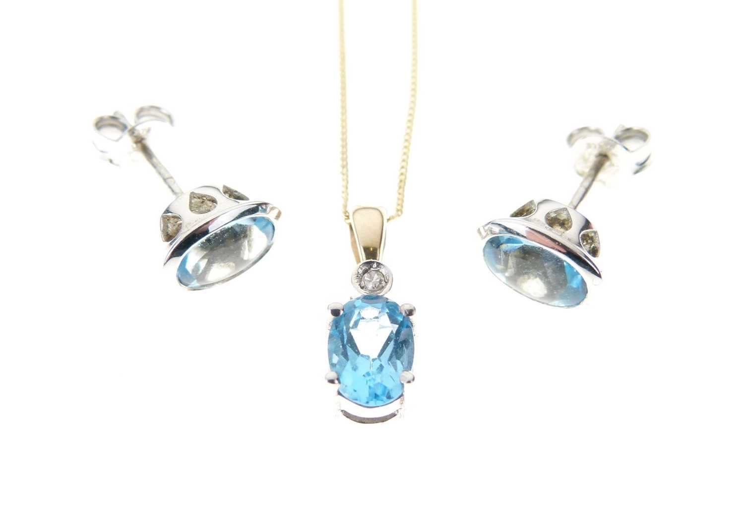 Lot 25 - 9ct gold, blue topaz and diamond pendant