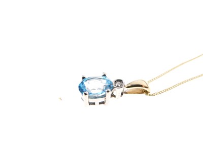 Lot 25 - 9ct gold, blue topaz and diamond pendant