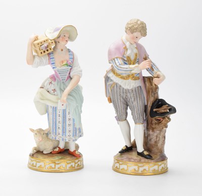 Lot 302 - Two Meissen figures - Lady with birdcage, and a young woodman gathering sticks in his hat