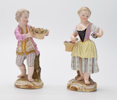 Lot 307 - Pair of Meissen figures holding flowers and fruit