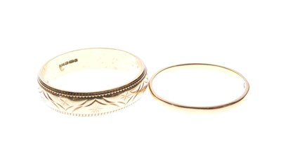 Lot 18 - 18ct gold wedding band, and a 9ct gold wedding band