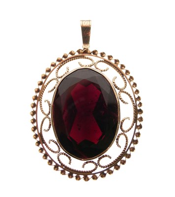 Lot 40 - 9ct gold pendant set large facetted red stone