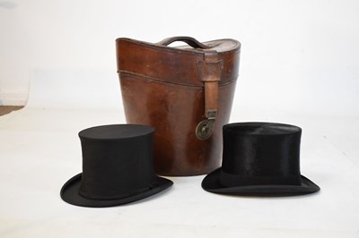 Lot 169 - Leather hatbox with two top hats