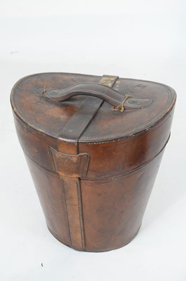 Lot 169 - Leather hatbox with two top hats