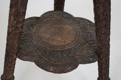 Lot 365 - Carved Indian tripod occasional table