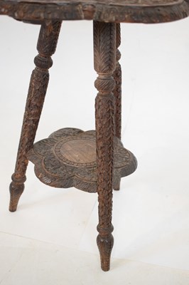 Lot 365 - Carved Indian tripod occasional table