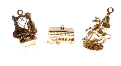 Lot 46 - Three 9ct gold charms
