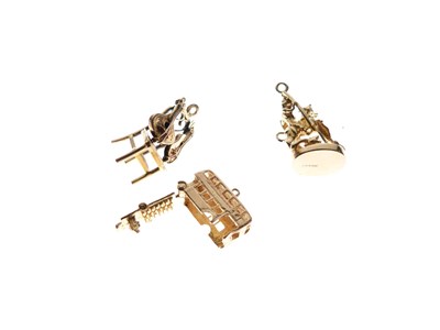 Lot 46 - Three 9ct gold charms