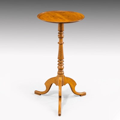 Lot 557 - Satinwood pedestal wine table