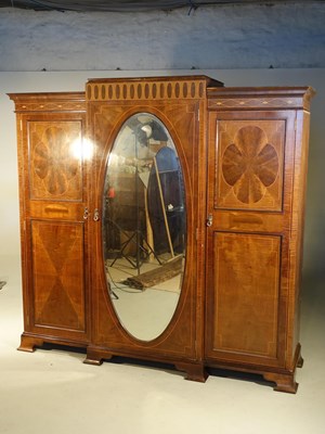 Lot 616 - Edwardian inlaid mahogany triple wardrobe