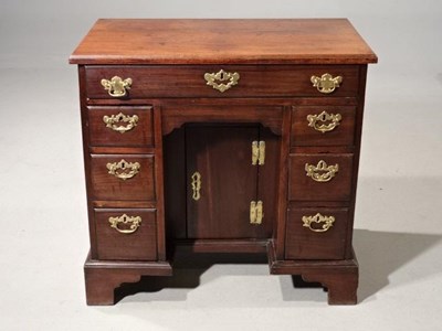 Lot 546 - George III mahogany kneehole desk