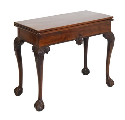 Lot 524 - Mahogany fold-over table with shell frieze