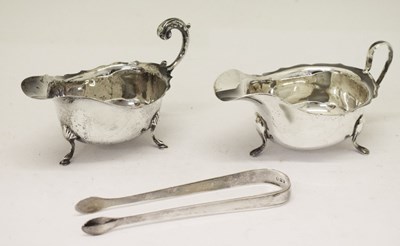 Lot 138 - Two George V silver sauce boats and a pair of silver sugar tongs